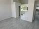 View of the main bedroom leading to the main bathroom with double sinks at 6625 Cherry Grove Cir, Orlando, FL 32809