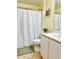 Bright bathroom with a shower-tub, white fixtures, and decorative wall accents at 6704 Westlake Blvd, Orlando, FL 32810