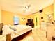 Bedroom featuring a king bed, vaulted ceiling, and tile flooring throughout at 6704 Westlake Blvd, Orlando, FL 32810