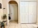 Neutral hallway with tile flooring, closet, and access to additional rooms at 6704 Westlake Blvd, Orlando, FL 32810