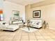 Elegant living room with neutral tones, tile flooring and contemporary furniture at 6704 Westlake Blvd, Orlando, FL 32810