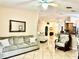 Spacious living room with tile floors and an open layout leading to the kitchen at 6704 Westlake Blvd, Orlando, FL 32810