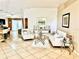 Bright living room with tile floors, comfortable seating, and stylish decor at 6704 Westlake Blvd, Orlando, FL 32810