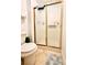 Bathroom featuring a shower with sliding doors and tiled floors at 6704 Westlake Blvd, Orlando, FL 32810