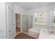 Bathroom features shower, tub, and access to closet at 6728 Duncaster St, Windermere, FL 34786