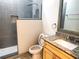 This bathroom features a granite countertop, a shower, and grey tiling at 6728 Duncaster St, Windermere, FL 34786