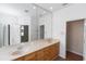 Spacious bathroom vanity with double sinks, large mirror, and tile flooring at 6728 Duncaster St, Windermere, FL 34786