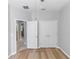 Bedroom with plank flooring and ensuite bath at 6728 Duncaster St, Windermere, FL 34786