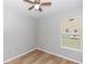 Comfortable bedroom with wood floors, ceiling fan, and lots of light at 6728 Duncaster St, Windermere, FL 34786