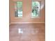 Bedroom with tile flooring and two windows providing lots of natural light at 6728 Duncaster St, Windermere, FL 34786