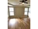 Spacious bedroom with laminate flooring, a ceiling fan, and natural light at 6728 Duncaster St, Windermere, FL 34786