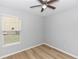 Bright bedroom with wood floors and ceiling fan at 6728 Duncaster St, Windermere, FL 34786