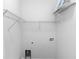 Walk-in closet with built-in shelving at 6728 Duncaster St, Windermere, FL 34786