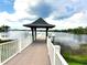 Lakefront gazebo at the end of a long dock at 6728 Duncaster St, Windermere, FL 34786