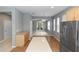 Open-concept kitchen features a stainless refrigerator, island, and access to dining area at 6728 Duncaster St, Windermere, FL 34786