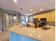 Spacious kitchen with stainless steel appliances and breakfast bar, open to the living area at 6728 Duncaster St, Windermere, FL 34786