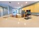 Kitchen with light wood cabinets, stainless steel appliances and quartz countertops at 6728 Duncaster St, Windermere, FL 34786