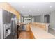 Bright kitchen features stainless appliances, tile floors and an island perfect for meal preparation at 6728 Duncaster St, Windermere, FL 34786