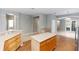 Kitchen with tile floors, stainless appliances, and large island with room for cooking at 6728 Duncaster St, Windermere, FL 34786