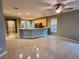 Open-concept living area featuring tile flooring, neutral paint and lots of natural light at 6728 Duncaster St, Windermere, FL 34786