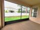 This is a screened in patio overlooking the backyard at 6728 Duncaster St, Windermere, FL 34786