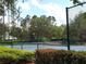 Enjoy a match on the community's tennis court surrounded by lush landscaping and mature trees at 6728 Duncaster St, Windermere, FL 34786