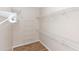 This walk-in closet provides ample storage with wire shelving for organized living at 6728 Duncaster St, Windermere, FL 34786