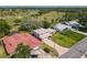 Aerial view of a home with well-maintained landscaping near a golf course, showcasing location and curb appeal at 721 Fairway Dr, New Smyrna Beach, FL 32168