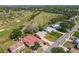 Aerial view of a home near a lush golf course, highlighting the beautiful surroundings and community at 721 Fairway Dr, New Smyrna Beach, FL 32168