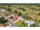 Aerial view of a well-maintained home near a lush golf course, showcasing its desirable location and landscaping at 721 Fairway Dr, New Smyrna Beach, FL 32168