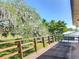 Second story balcony overlooking serene backyard at 721 Fairway Dr, New Smyrna Beach, FL 32168