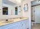 Bathroom featuring dual sinks and an enclosed shower at 721 Fairway Dr, New Smyrna Beach, FL 32168