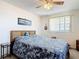 Inviting bedroom featuring a cozy bed, natural light, and traditional decor at 721 Fairway Dr, New Smyrna Beach, FL 32168