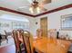 Elegant dining room featuring a large wood table and views into other rooms at 721 Fairway Dr, New Smyrna Beach, FL 32168