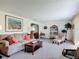 Spacious living room featuring comfortable seating, decorative accents, and a seamless flow to other living areas at 721 Fairway Dr, New Smyrna Beach, FL 32168