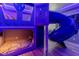 Cool, themed bedroom with custom bunk bed and slide at 8180 Valhalla Ter, Reunion, FL 34747