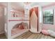 Whimsical bedroom featuring a custom-built bunk bed, chandelier, and pink accents at 8180 Valhalla Ter, Reunion, FL 34747