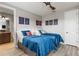 Bedroom featuring two beds, posters, and attached bath at 8180 Valhalla Ter, Reunion, FL 34747