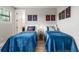 Charming bedroom with two twin beds, Harry Potter themed decor, and comfortable blue bedding at 8180 Valhalla Ter, Reunion, FL 34747