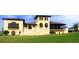 A charming clubhouse with manicured lawn, steps to enter, and a sunny disposition at 8180 Valhalla Ter, Reunion, FL 34747