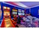 Entertainment game room featuring vintage arcade games, bar and stool seating, perfect for fun at 8180 Valhalla Ter, Reunion, FL 34747