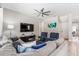 Spacious living room features neutral decor and ample natural light through window at 8180 Valhalla Ter, Reunion, FL 34747