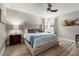 Main bedroom with soft decor, fan, and ample natural light through windows at 8180 Valhalla Ter, Reunion, FL 34747