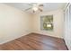 Bedroom featuring hard wood floors, a window, and a spacious closet at 916 Glendale St, Orlando, FL 32807