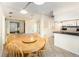 Dining area featuring a wooden table with seating near the kitchen and living areas at 916 Glendale St, Orlando, FL 32807
