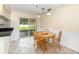 Dining area featuring wood table, tile flooring, and sliding door access to patio at 916 Glendale St, Orlando, FL 32807