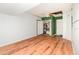 Bright, unfinished room with wood-look floors, closet, ceiling fan, and painted accent wall at 916 Glendale St, Orlando, FL 32807
