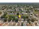 Wide aerial shot of a residential area near a pond, showcasing community and landscape at 2527 Christine Dr, Kissimmee, FL 34744