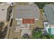 Aerial view of fenced backyard featuring mature trees, patio, and screened-in porch at 2527 Christine Dr, Kissimmee, FL 34744