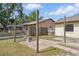The backyard has a brick patio area with wooden posts for lights at 2527 Christine Dr, Kissimmee, FL 34744